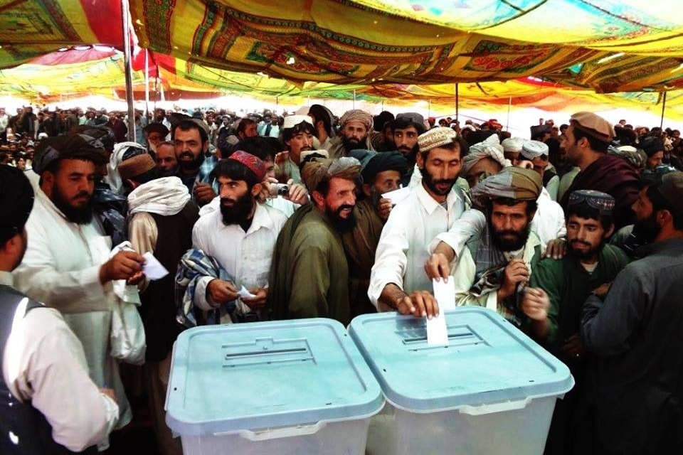 Men voting in a ballot