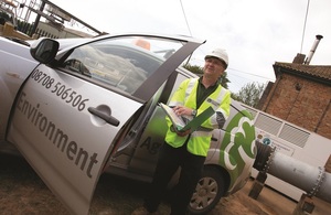 An Environment Agency officer arrives at a site to carry out an inspection