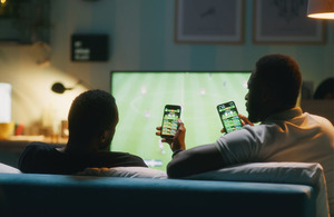 People watching sport on phone and TV catch up service
