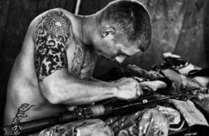 Best Overall Image: 'Celtic Warrior' – Private Ross Cunningham cleaning his personal weapon [Picture: Corporal Jamie Peters RLC, Crown copyright]