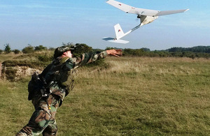 A mini unmanned aerial system is launched by a Dutch serviceman during training on Salisbury Plain [Picture: Crown copyright]