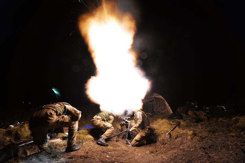 Paratroopers fire an 80mm mortar round