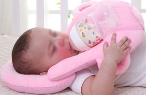 Baby using self-feeding pillow