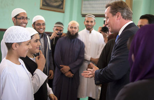 David Cameron meets members of a mosque in Manchester.