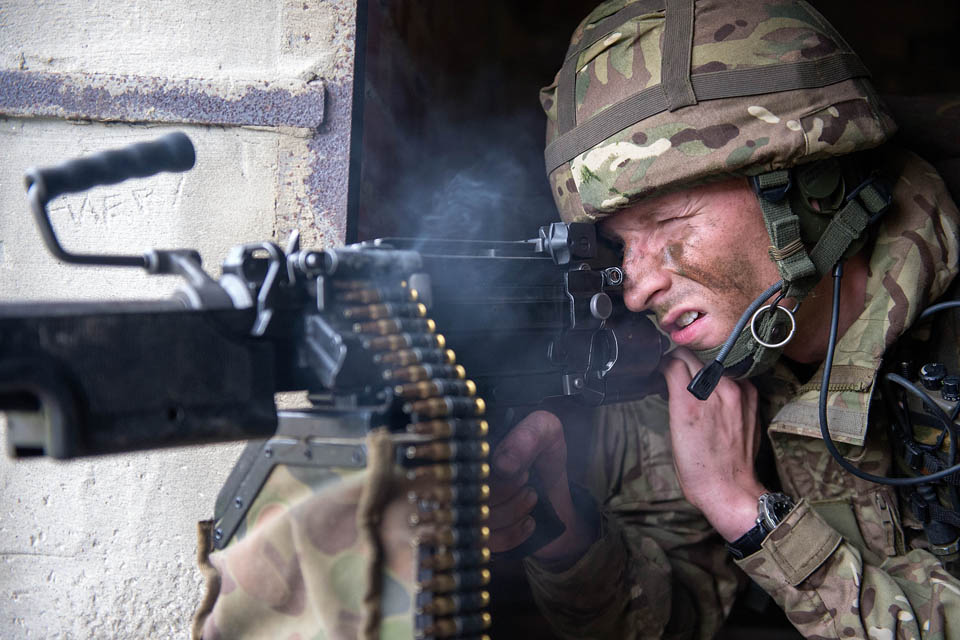 A rifleman mans a machine gun