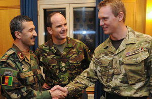 Colonel Farid Ahmadi shakes hands with Lieutenant Pete Quentin of The London Regiment