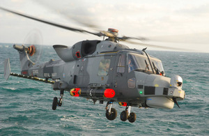 A Wildcat helicopter undergoing trials from HMS Iron Duke