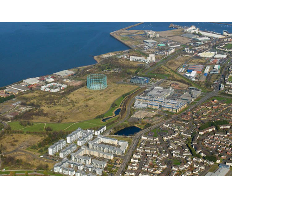 Aerial shot of the Granton Waterfront area in Edinburgh, showing the sea and the gasholder.