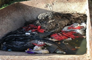 A waste skip contains sewage debris