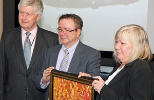 High Commissioner Howard Drake with the Fillion family at the handover ceremony.