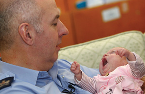 Warrant Officer Ian Phillips with baby Poppy Jane whose life he saved