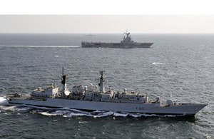 HMS Cumberland (foreground) and French carrier Charles de Gaulle (background)