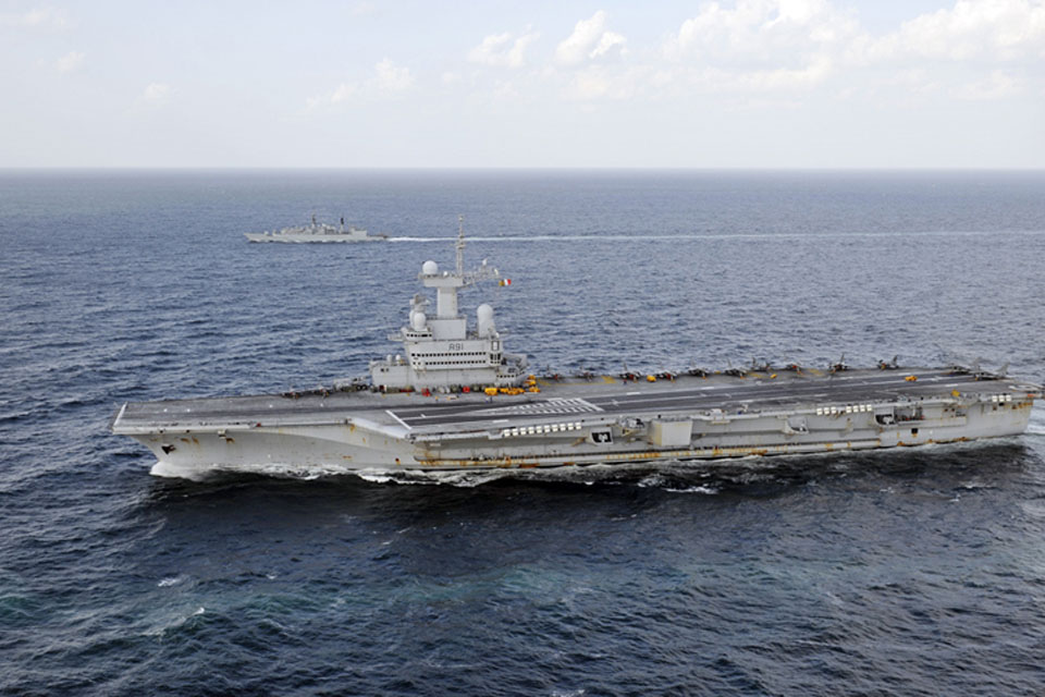 HMS Cumberland (background) and French carrier Charles de Gaulle (foreground) 