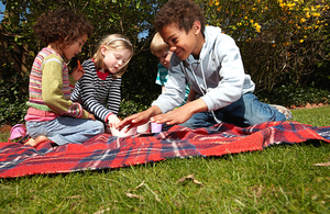 Children playing on a blanket