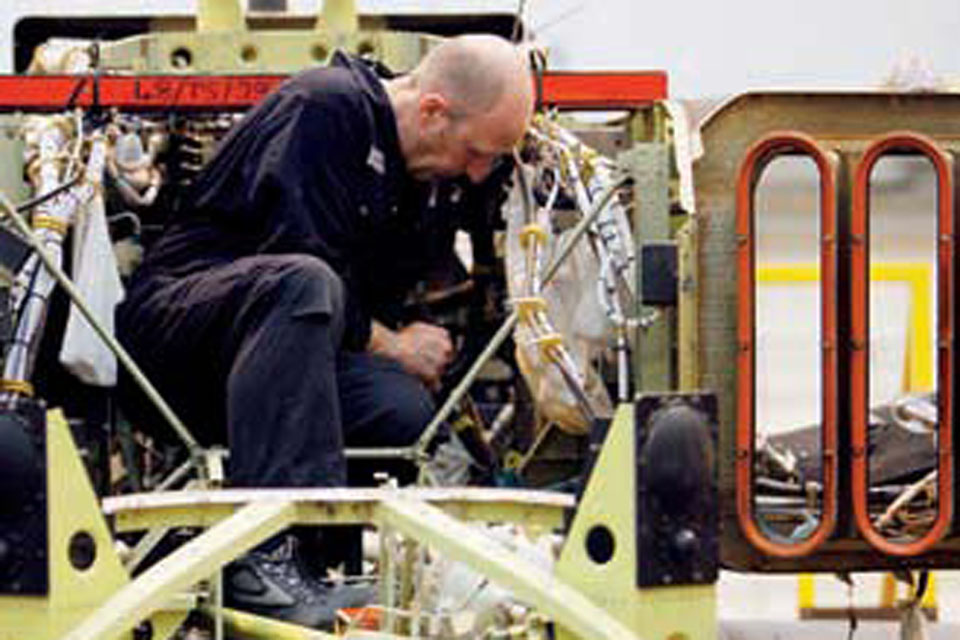 Technical experts repair and replace worn or damaged parts in the Depth Support Unit's huge hangar  