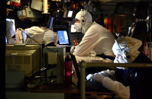 Personnel manning HMS Bulwark's operations room as the ship comes under simulated attack [Picture: Leading Airman (Photographer) Arron Hoare, Crown copyright]