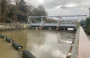 The Taplow gantry can be seen in the middle distance, surrounded by grey skies and rippling waters