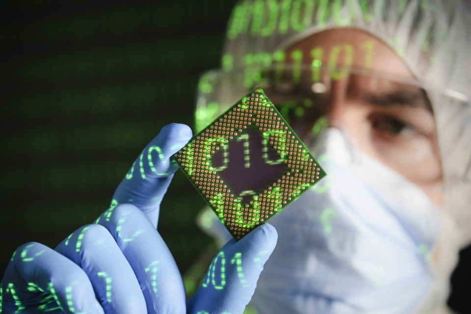 Clean room worker holding a CPU