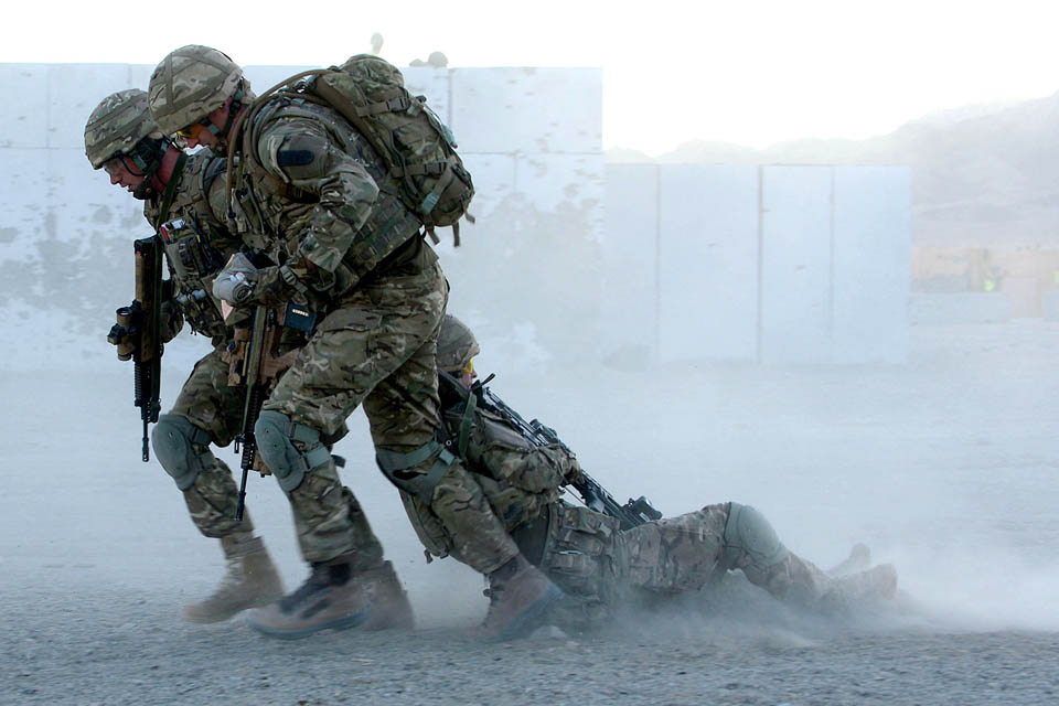 Royal Marines commandos drag an 'injured' colleague to safety