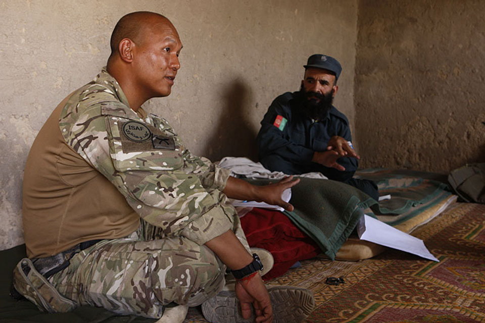 Sergeant Basanta Rai with a member of the Afghan Uniform Police
