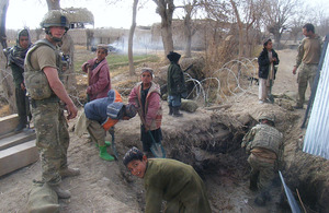 Afghan children helping British Royal Engineers