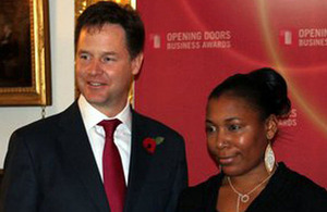 Naomi Tamar picking up her award from Nick Clegg