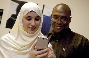 Two people viewing a phone