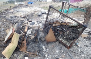 Image shows waste on the site with evidence of burning