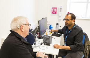 GP speaking to a patient in a consulting room