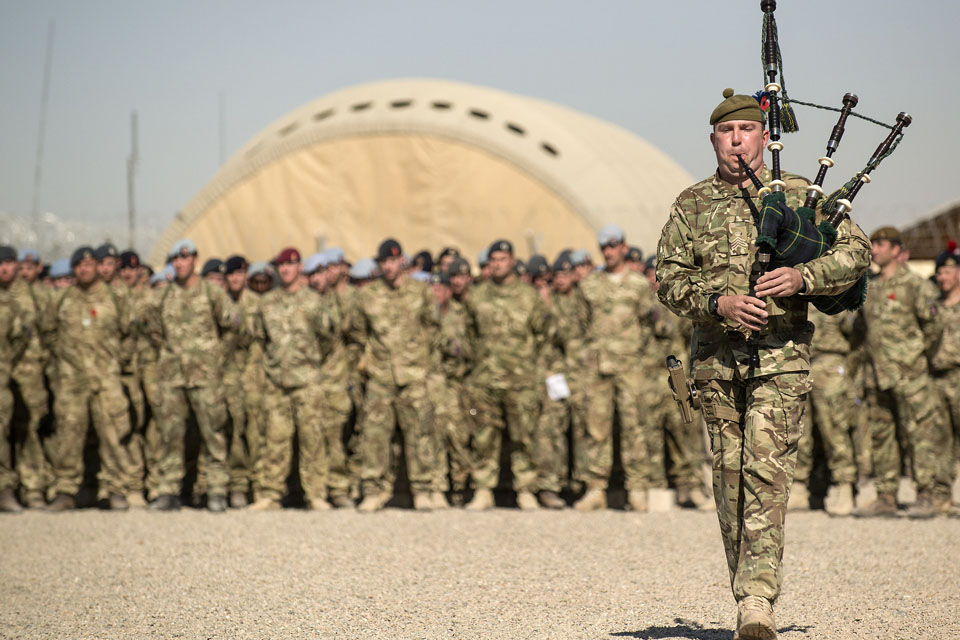 Troops pay their respects at the remembrance service held at Camp Bastion 