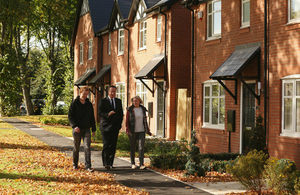 David Cameron is shown around a housing development