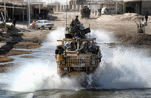 Members of 3rd Battalion The Parachute Regiment splash through a ford