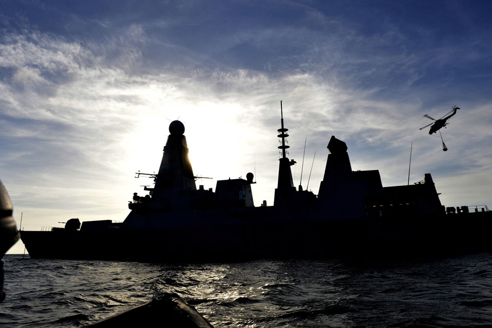 A Lynx helicopter leaves HMS Daring
