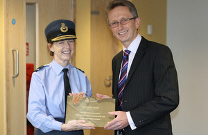 Air Vice-Marshal Elaine West receives a commemorative plaque from Graham Jeffery, Debut Services Head of Defence Frameworks [Picture: Crown copyright]