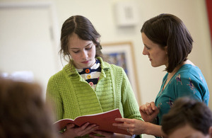 Teacher talking to student