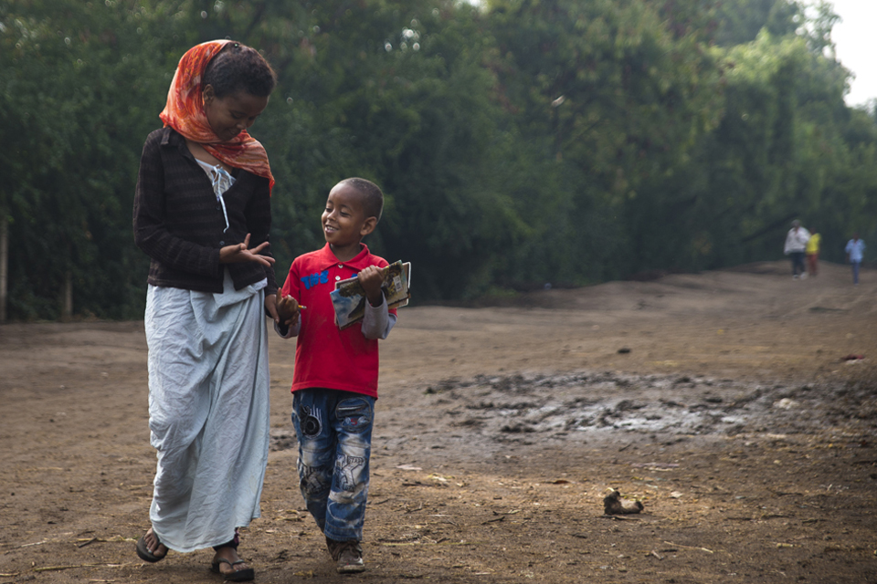 Momina walks her son Rapira, 6, to school. Picture: Benjamin Chesterton/duckrabbit/International HIV/AIDS 