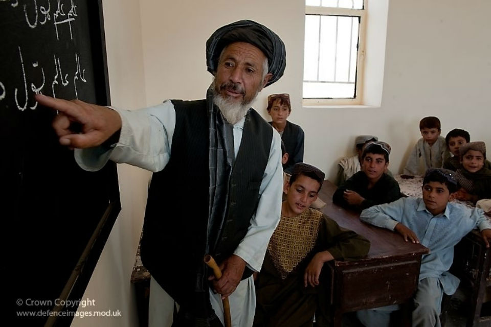 Afghan boys with their teacher in school.