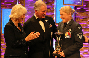 Prince Charles and the Duchess of Cornwall presenting the Most Outstanding Airman Award to Sergeant Anna Irwin [Picture: Copyright The Sun]