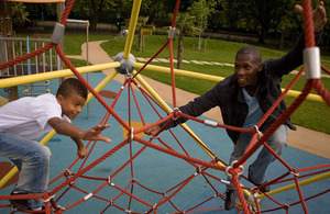 Father and son playing in a park
