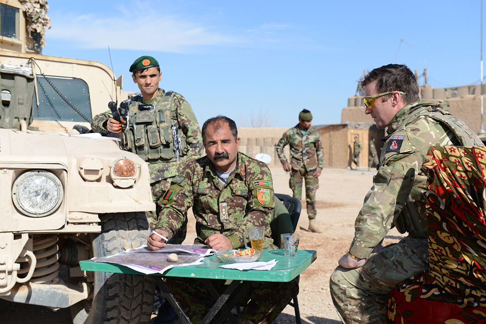 Major Andy Mclannahan assists the Afghan command element