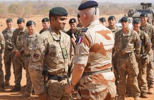 Rifleman Gigar Das receives his lance corporal's stripe from General Bertrand Ract-Madoux in Mali [Picture: Crown copyright]