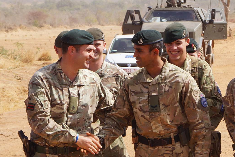 Major Sam Cates congratulates Lance Corporal Gigar Das