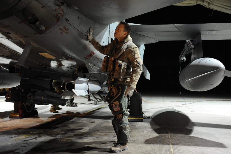 Squadron Leader Mark Jackson carries out pre-flight checks