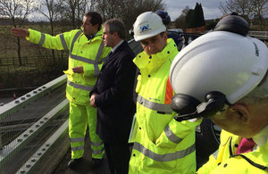 Robert Goodwill visiting the M2 hole location with workers