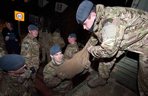 Personnel from RAF Honington distribute sandbags to residents in the Thames Valley caught up in the widespread flooding [Picture: Corporal Neil Bryden RAF, Crown copyright]