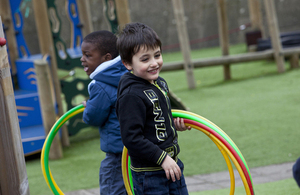 Boys playing with hula hoops