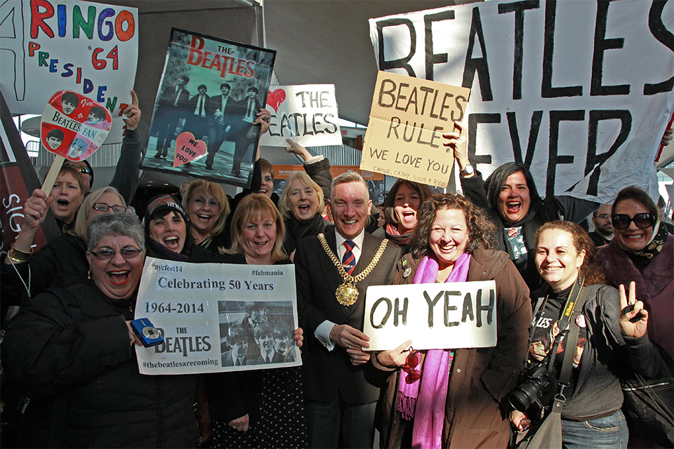 Lord Mayor of Liverpool Gary Millar and the Beatles fans at JFK Airport. Photo by Martin Roe.