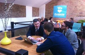 David Gauke shows Grabble founders Daniel Murray and Joel Freeman the Employment Allowance online calculator.