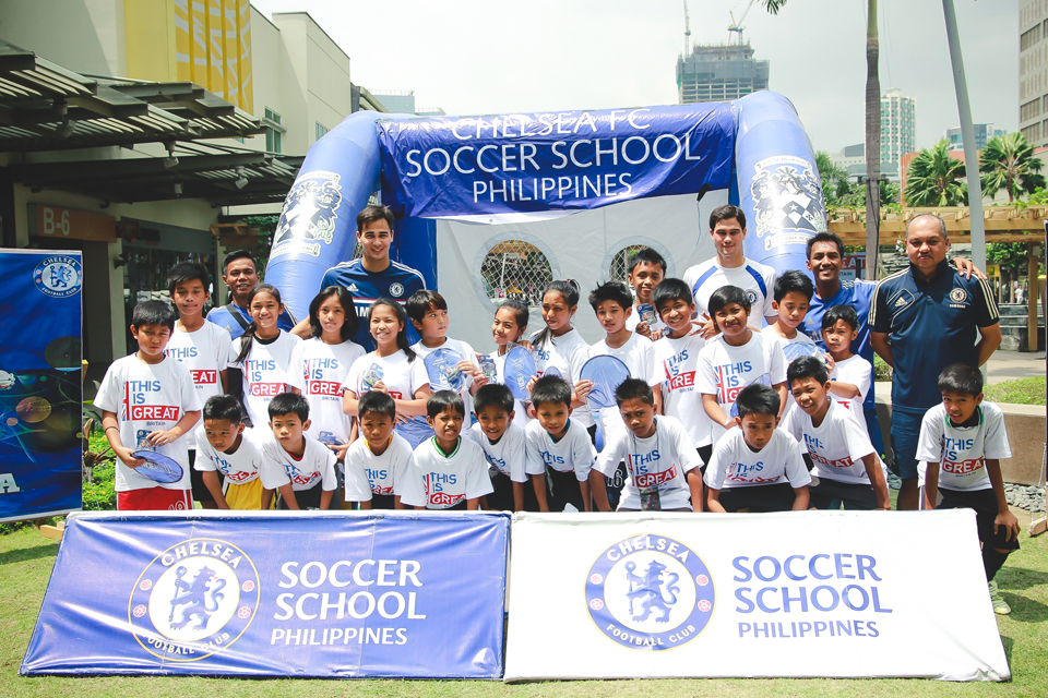 Group photo of the members of the Chelsea FC Soccer School Philippines including Azkal Players Phil and James Younghusband and the children who participated in the football drills