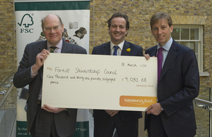 Nick Clegg presenting cheque to Forest Stewardship Council.